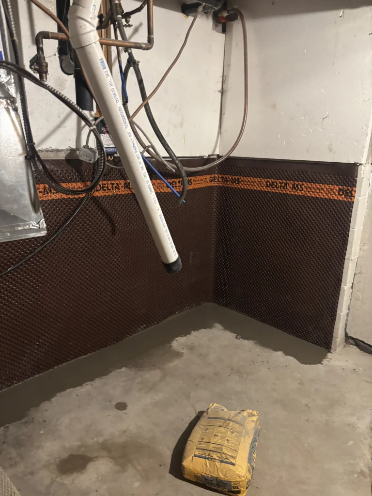New concrete floor patch against the waterproofing membrane