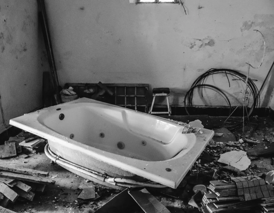Bathroom torn out with the old tub pulled free