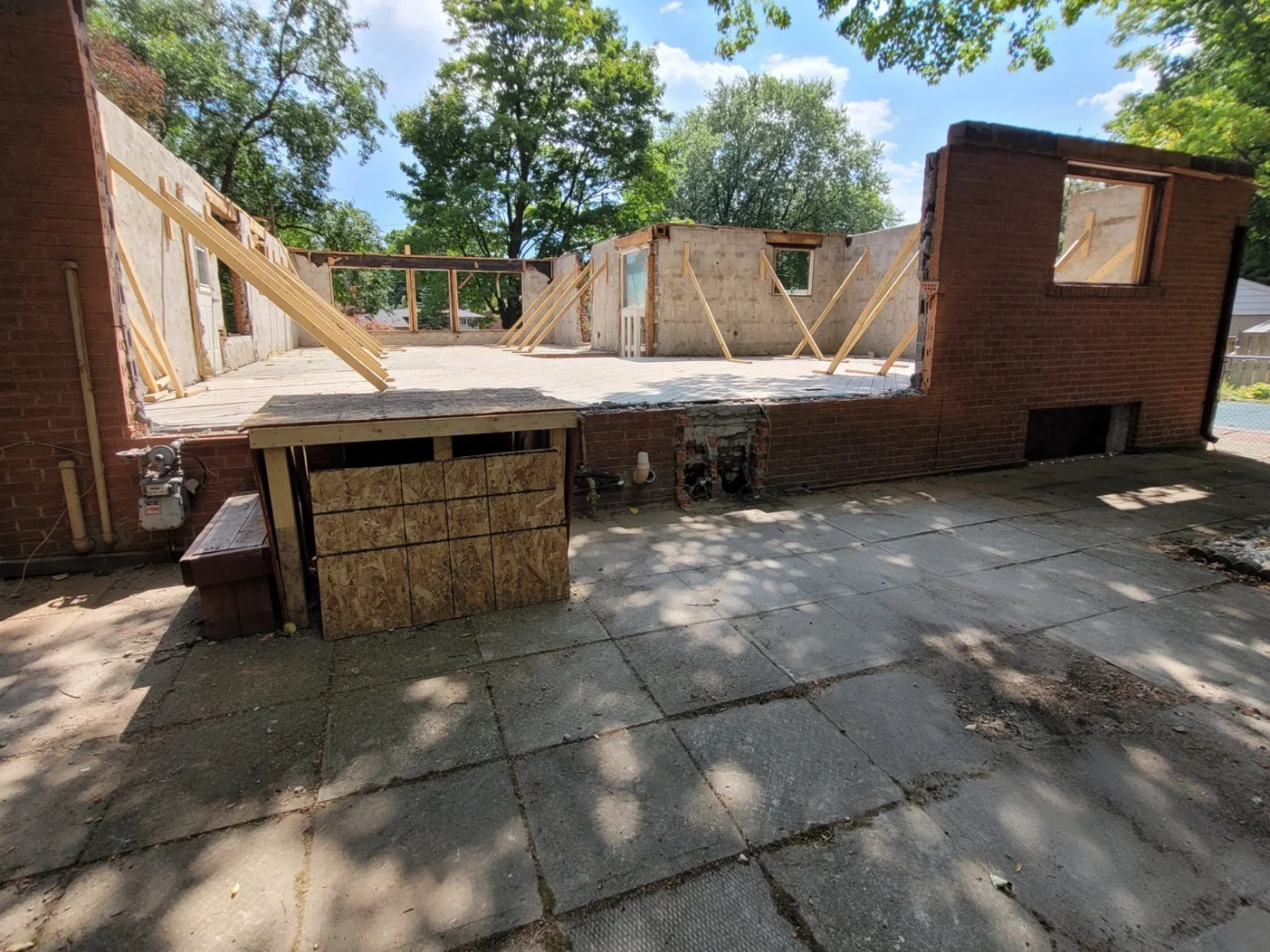 Brick house with the upper floor removed down to the main walls