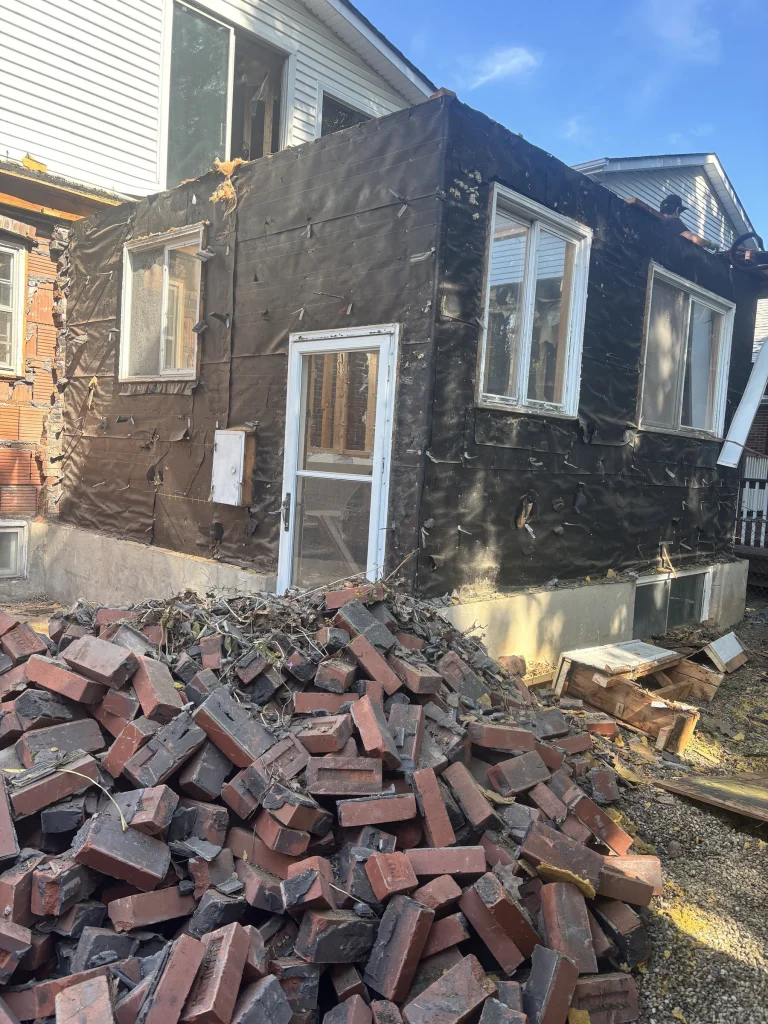 Brick veneer removed from an addition and piled for recycling