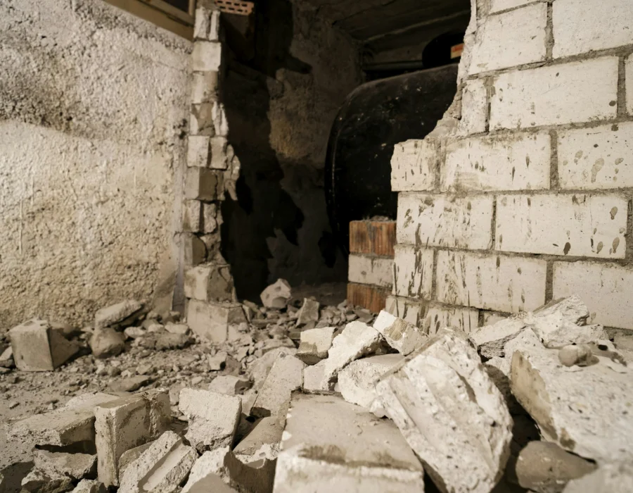 Broken brick and plaster from a wall taken down by hand