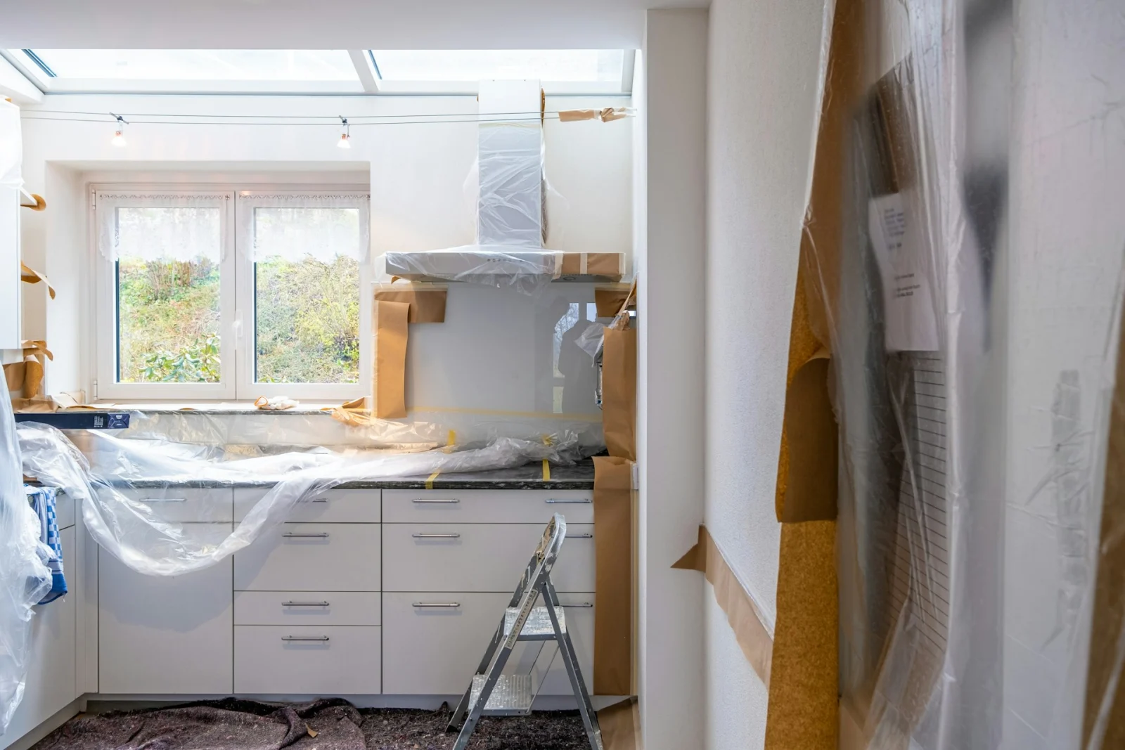 Kitchen wrapped in plastic sheeting to keep dust contained
