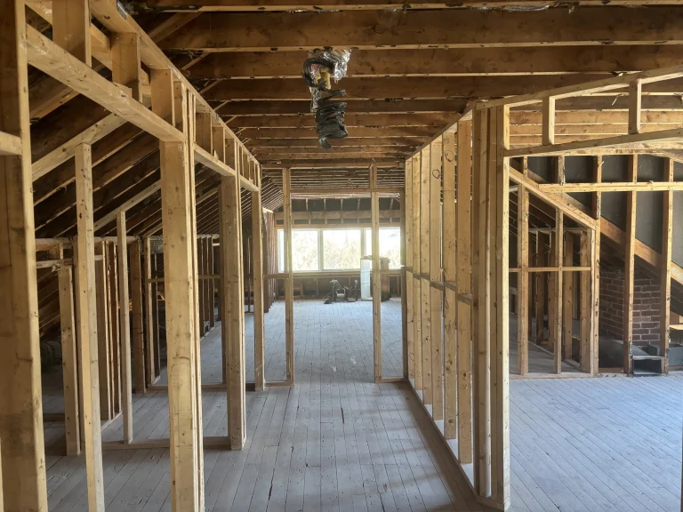 Second floor stripped to bare wall framing and subfloor