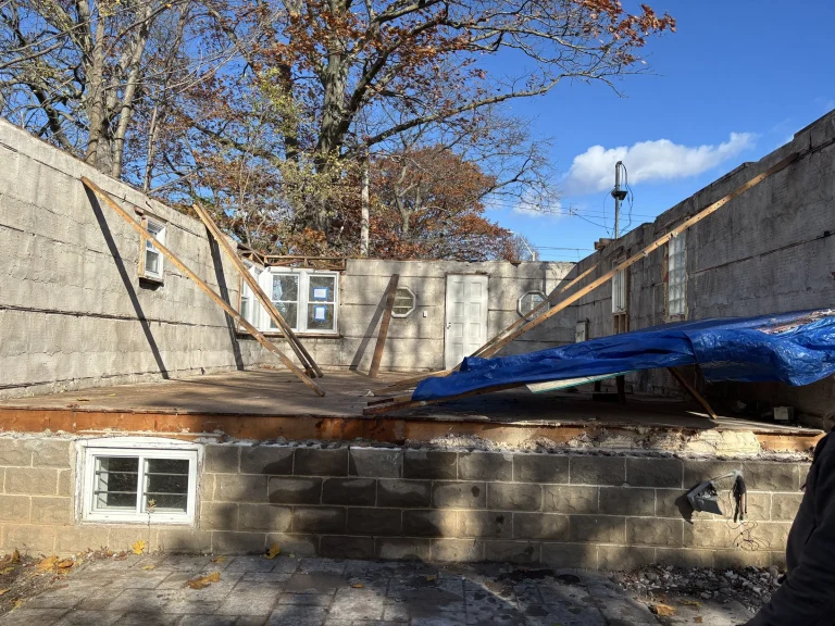House taken down to the main floor walls with bracing in place