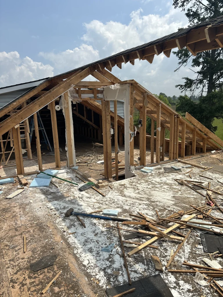 Roof framing taken apart by hand during a selective demolition