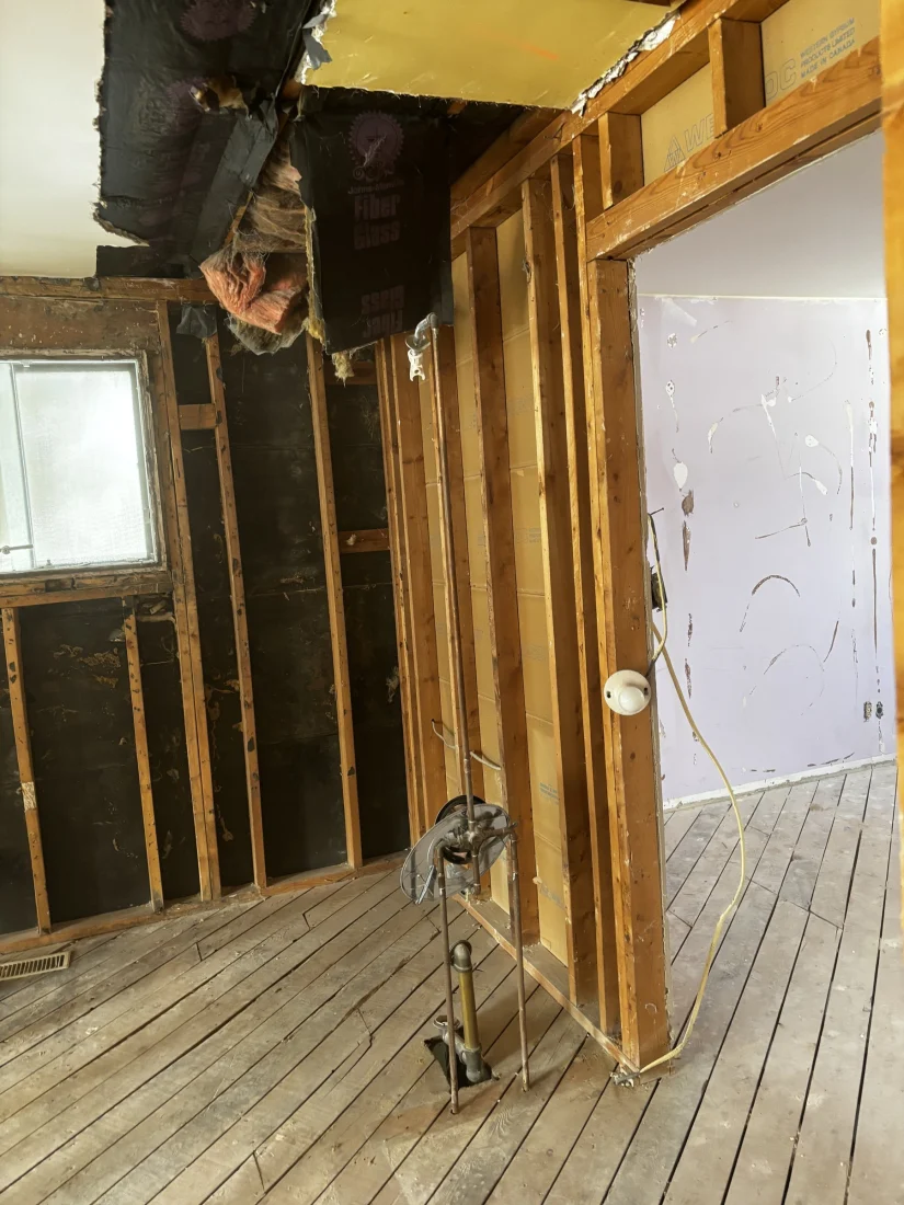 Wall opened to the framing with the ductwork exposed